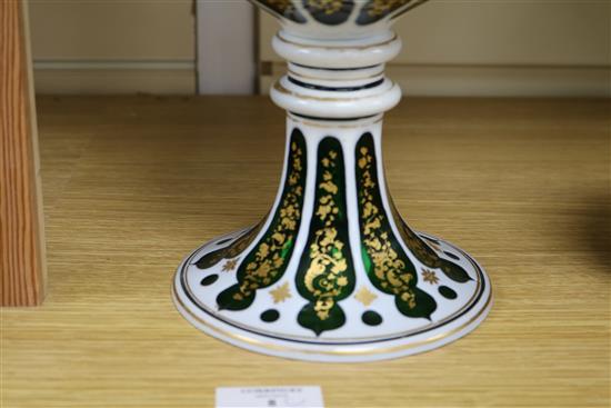 A late 19th century Bohemian white and green overlaid cut glass standing cup H24.5cm